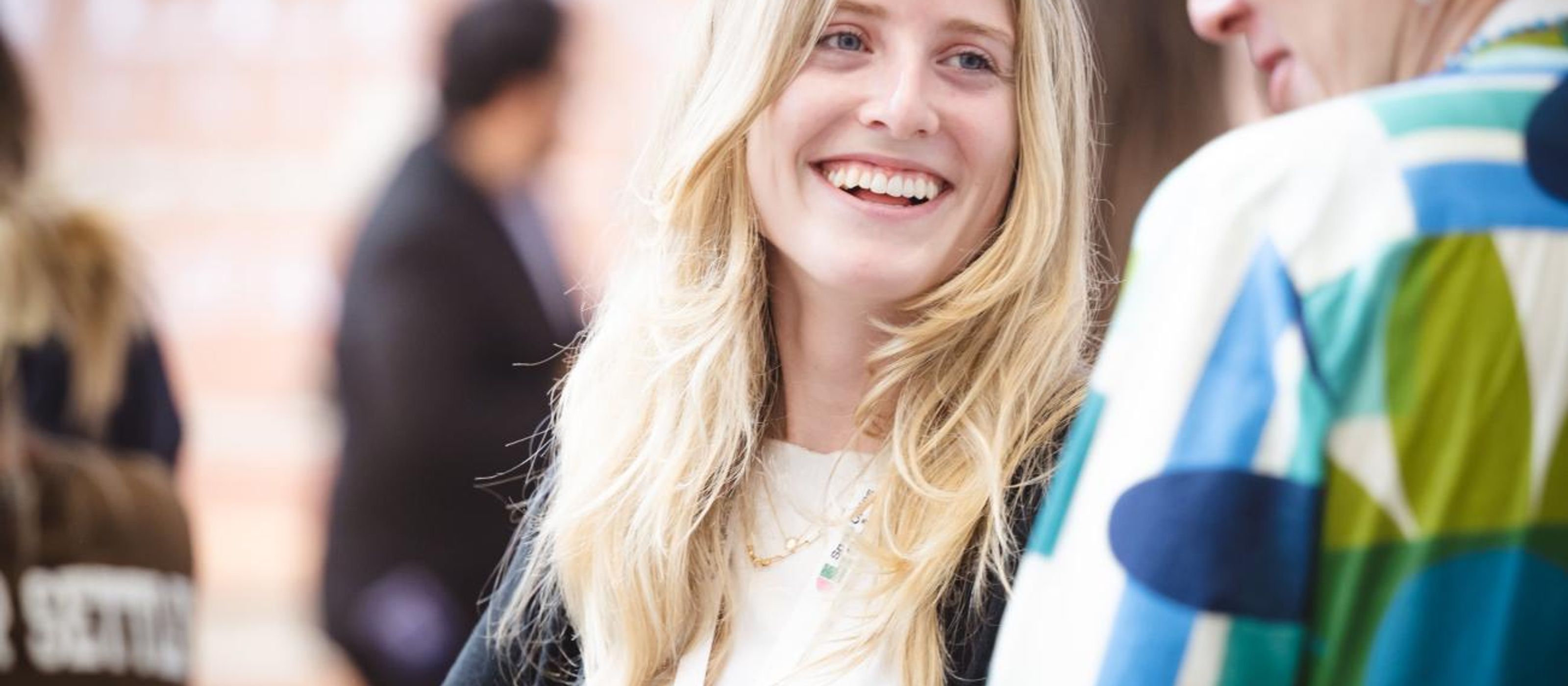 Isabelle O’Toole speaks with a woman at the co-lab event