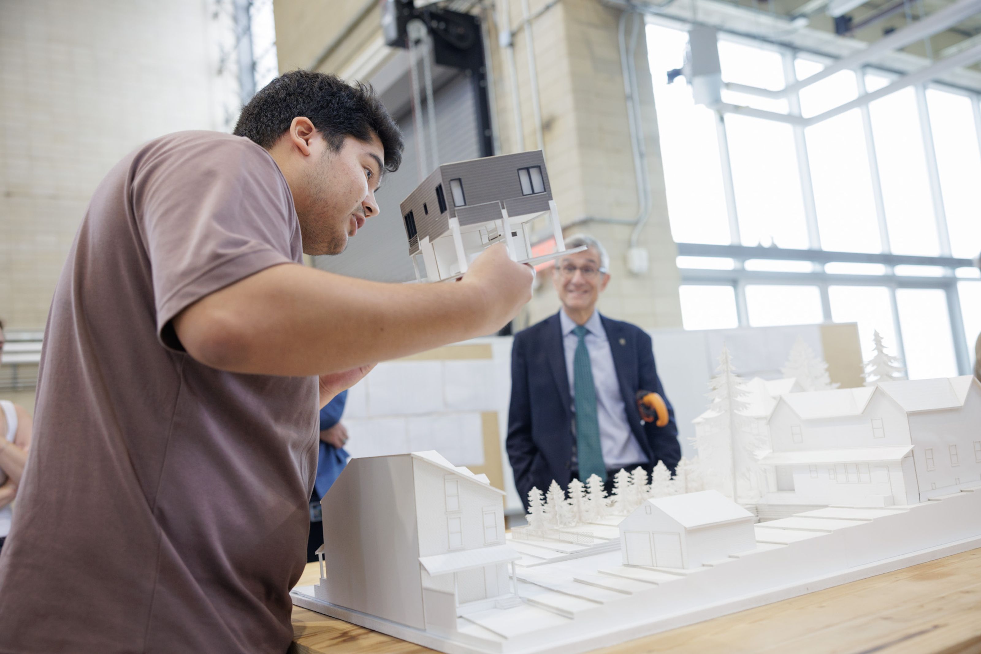Juan, displaying the final alley house model for the unit on Raspberry 