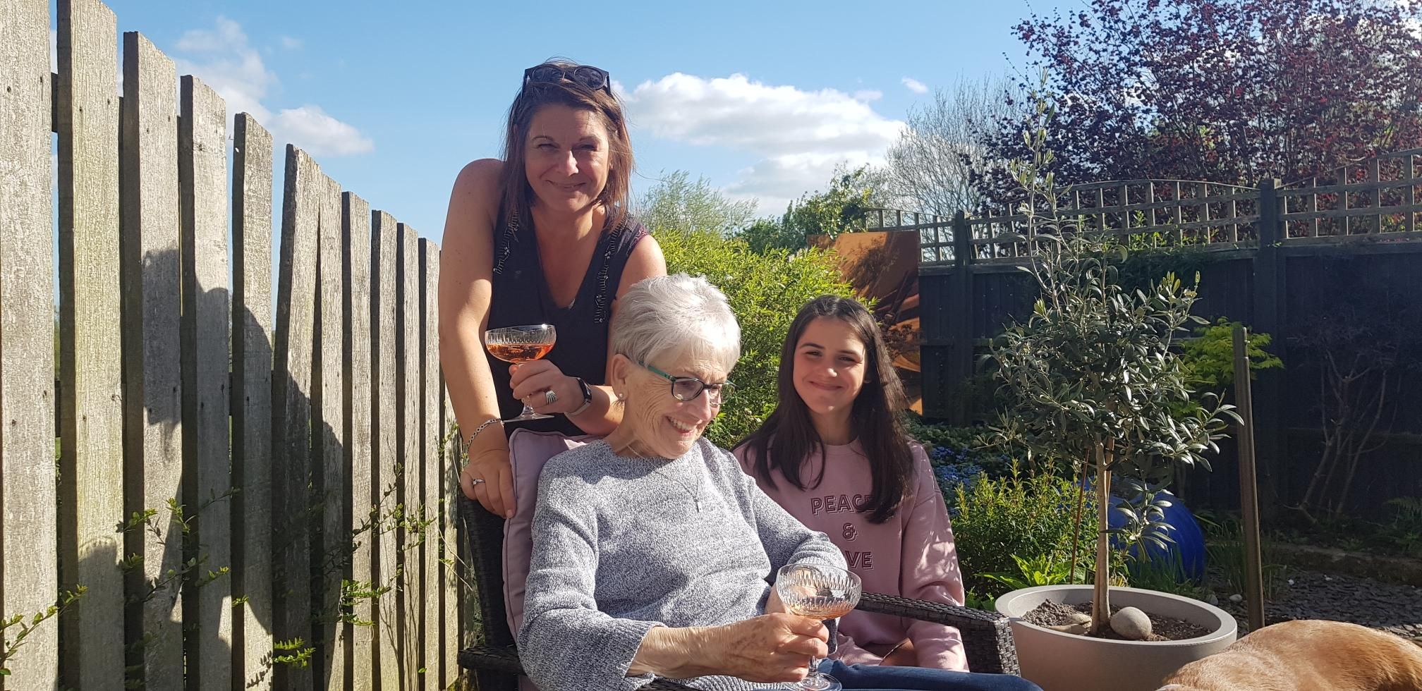 Photo of article writer Steph Smith drinking cocktails in a garden with her mum and daughter