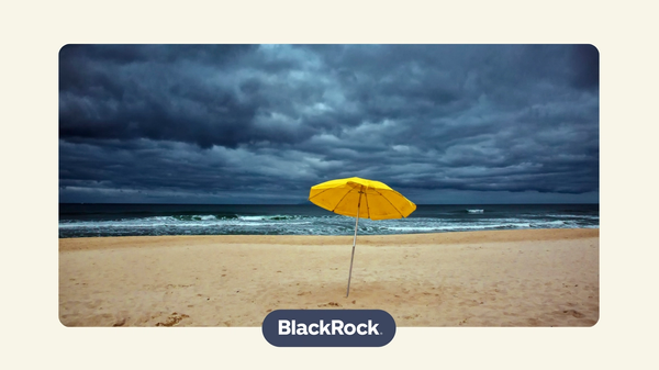 a single yellow umbrella on a cloudy, stormy beach