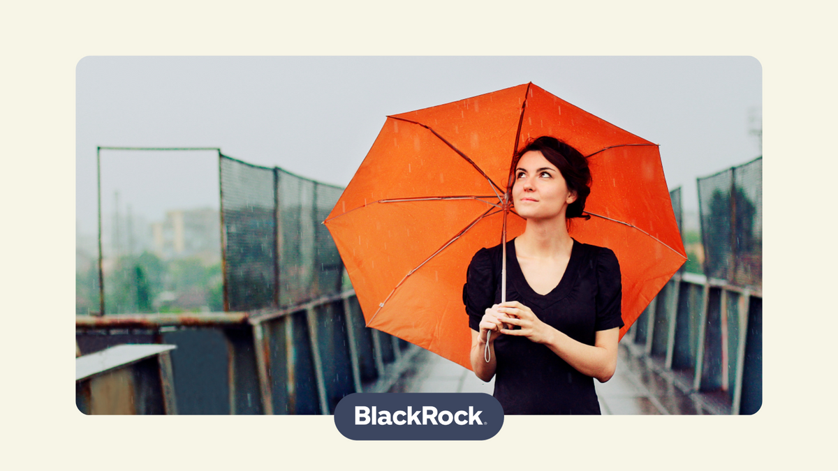 British woman holding an orange umbrella