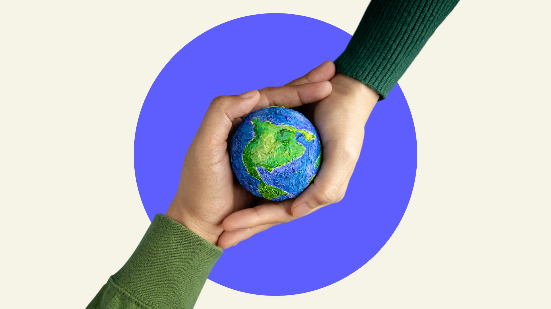 Two pairs of hands holding a model of planet Earth
