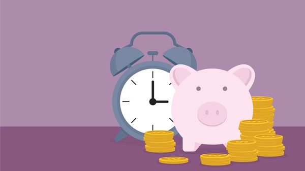 Piggy bank, clock and coins.