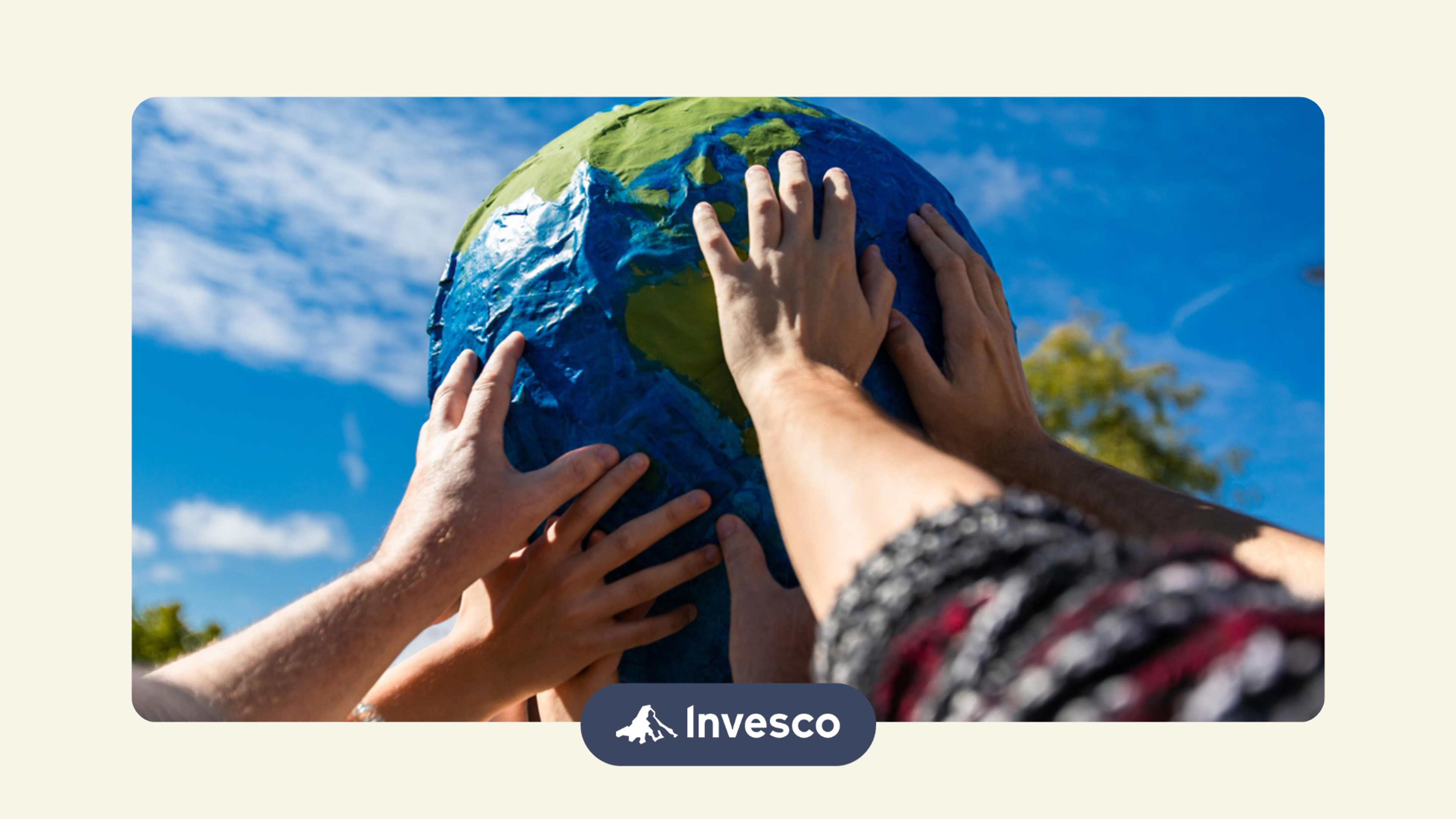 people holding a Globe as a representation of investing in international markets