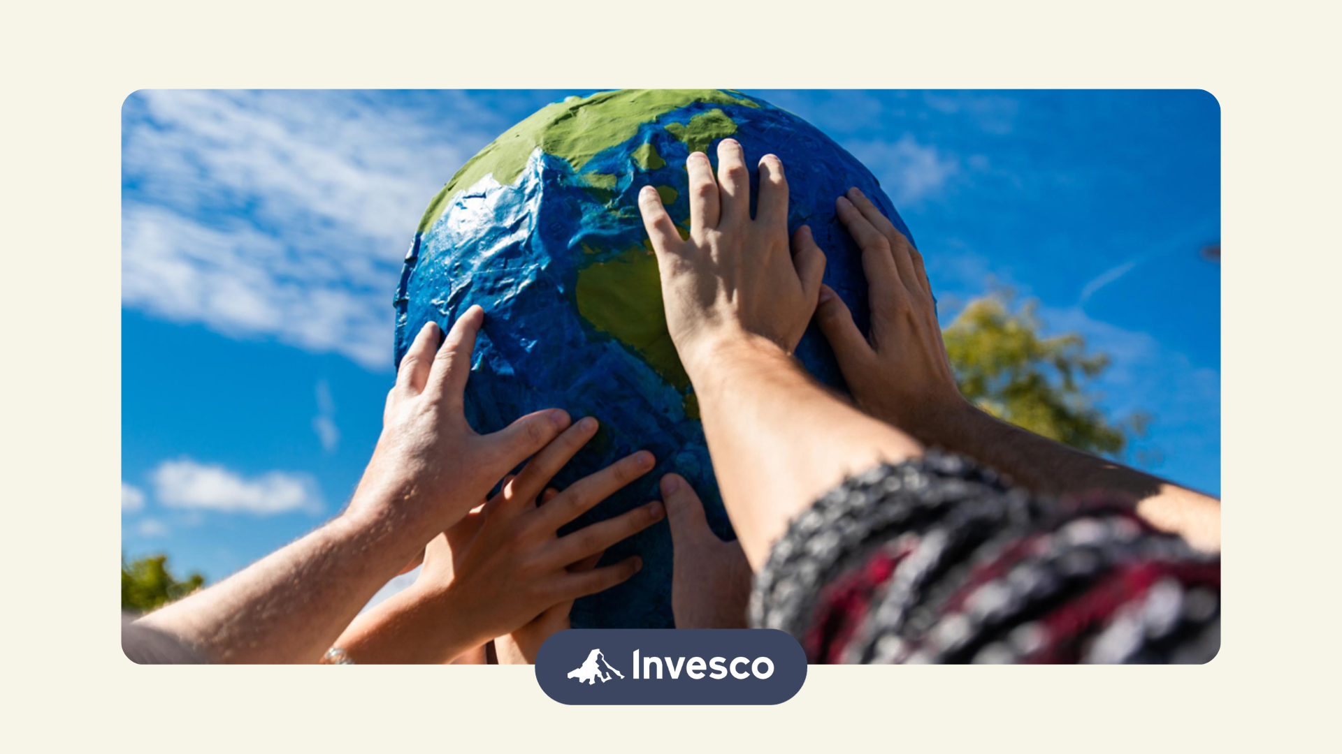 people holding a Globe as a representation of investing in international markets