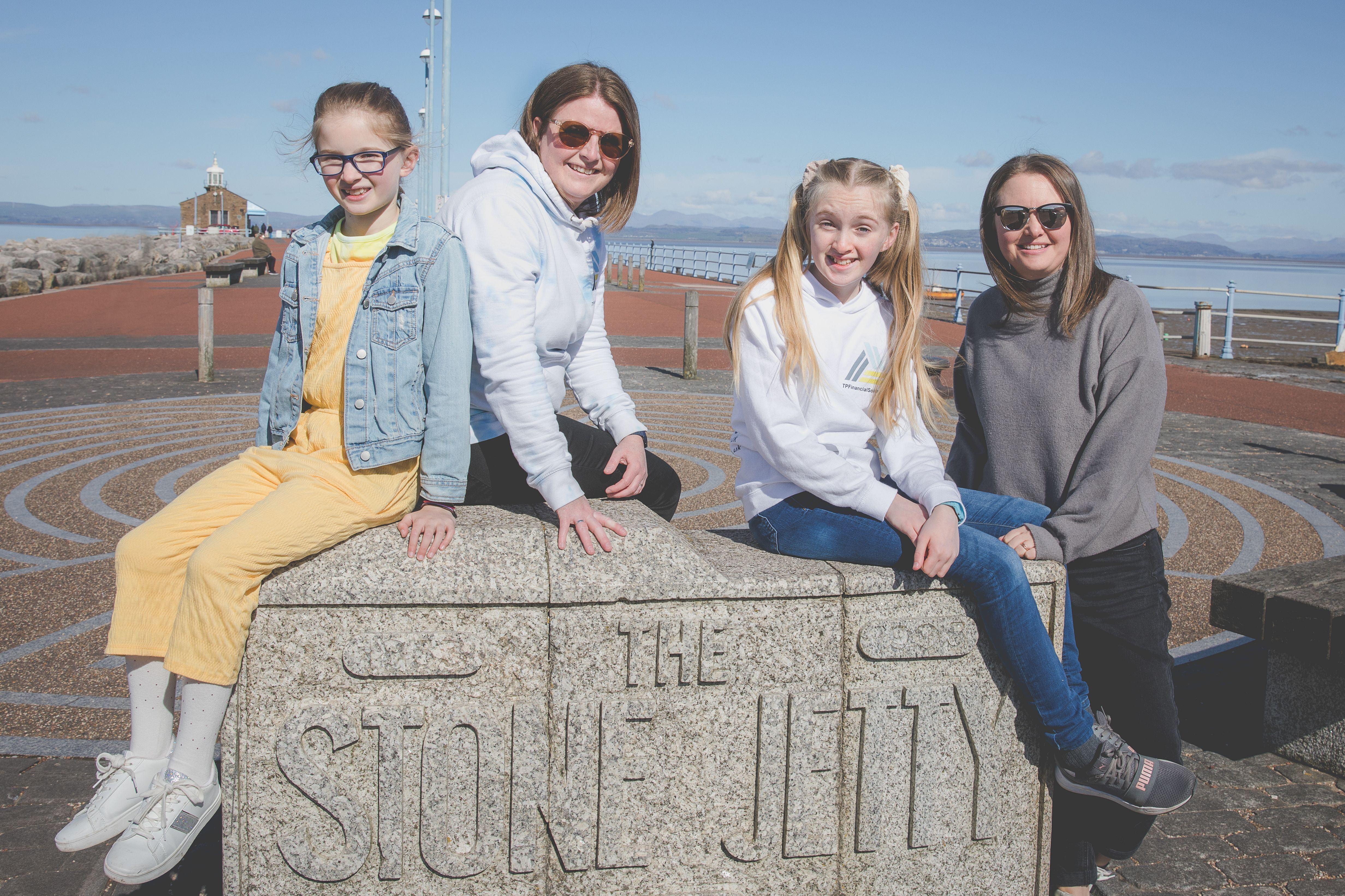 A photo of co-parents Annabel and Tarnia with their two daughters on a family day out