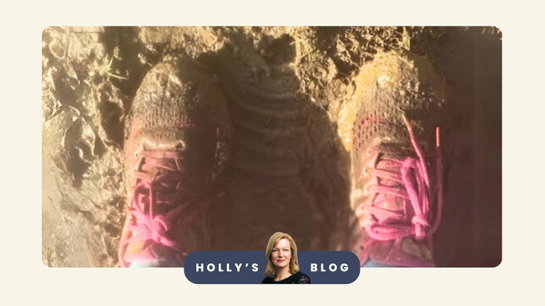 An image of pink trainers stuck in the mud