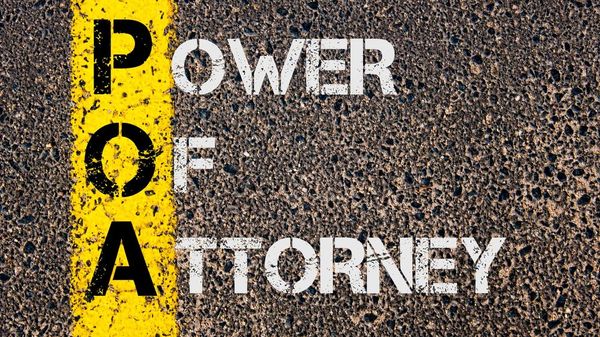 A road painted with the words "power of attorney"
