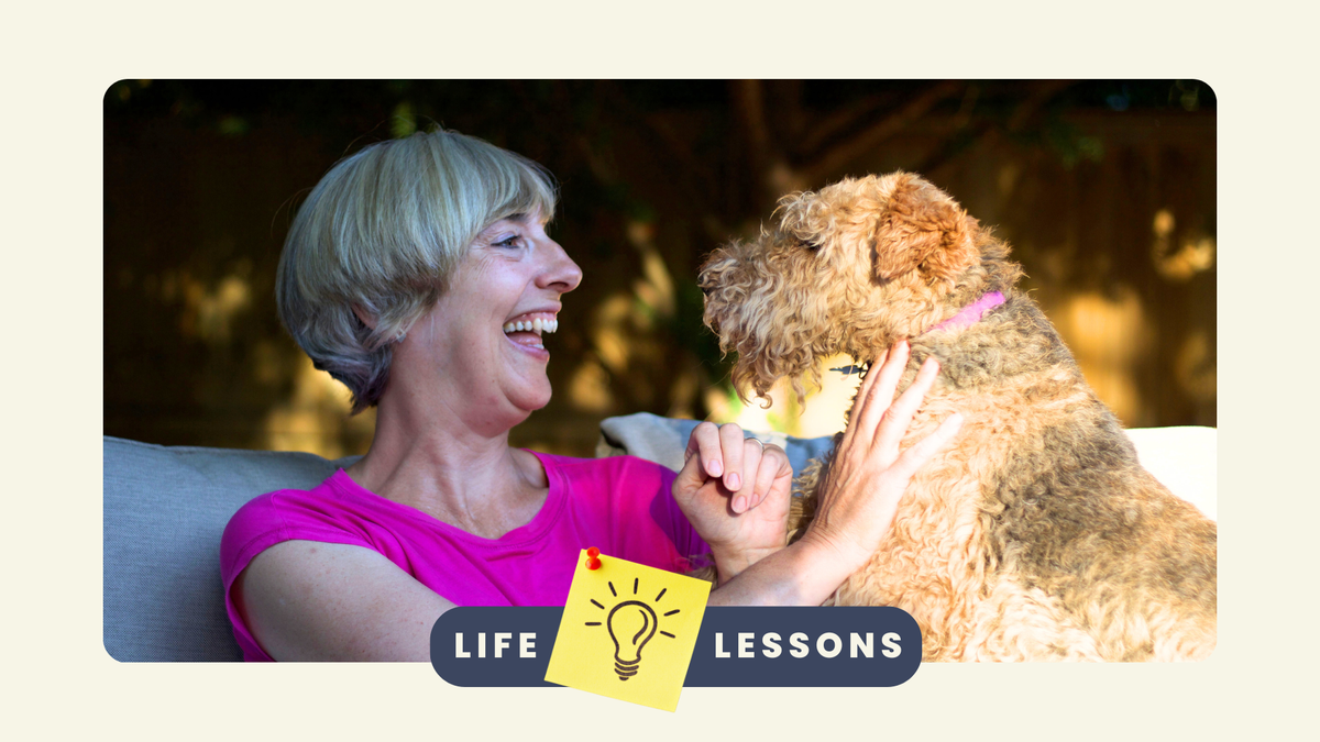 Article writer Carole Haswell laughing with her pet dog Winnie