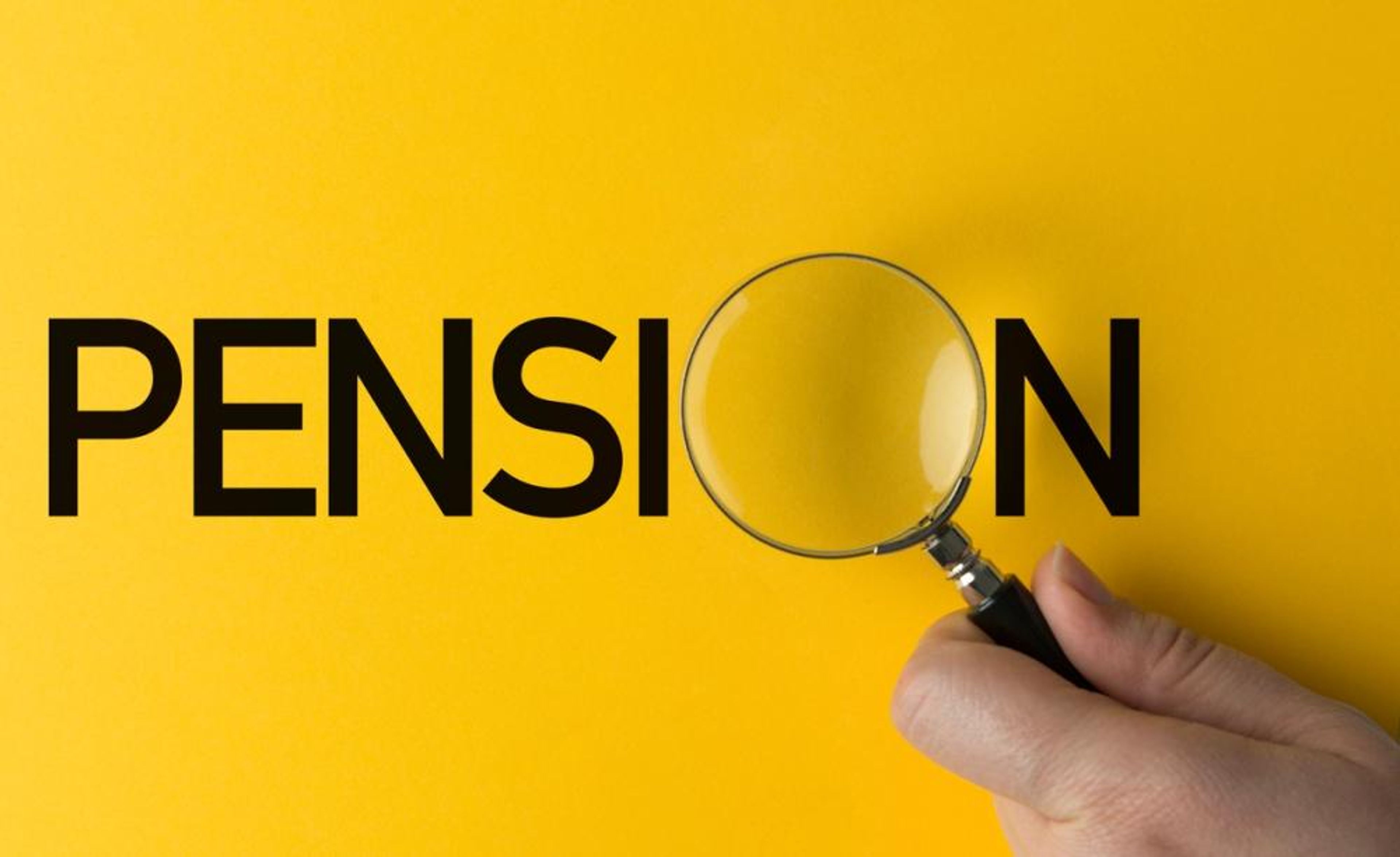 A hand holding a magnifying glass over the word "pension"