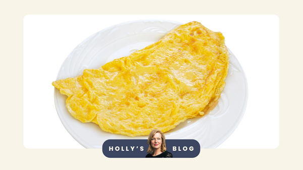 An image of a large omelette on a China plate
