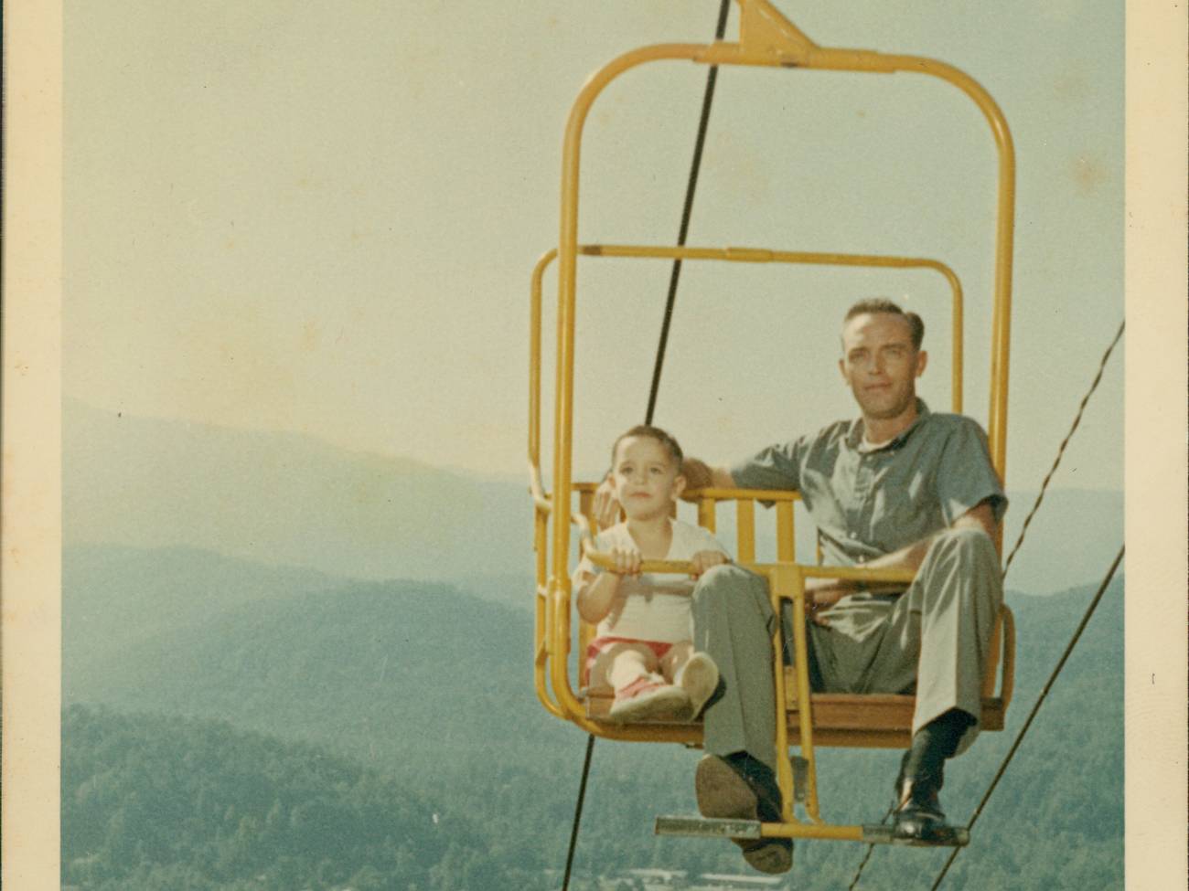 Former GM Clayton Watson riding the SkyLift with his son, and current GM Randy Watson.