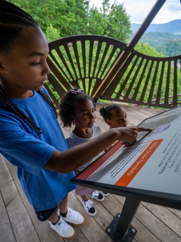 Kids reading the interacting with the signs in the Tulip Tower