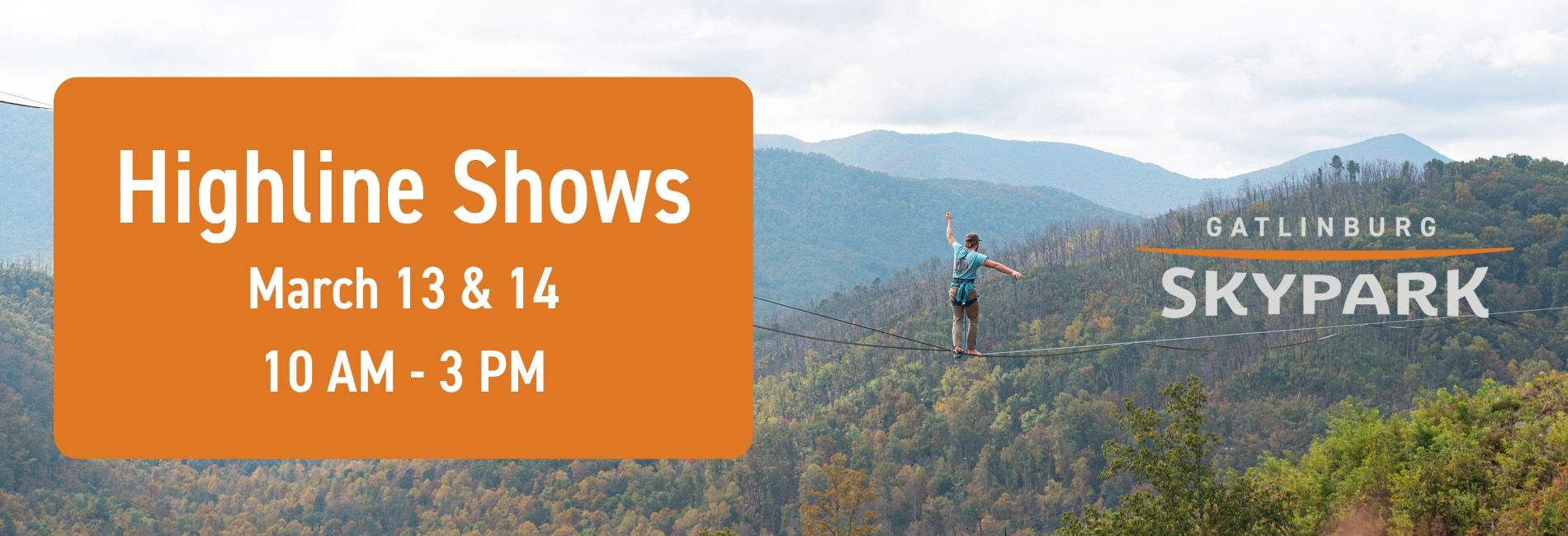 A highliner walking a slackline across the valley of the SkyBridge.