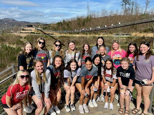 group photo with skybridge in the background