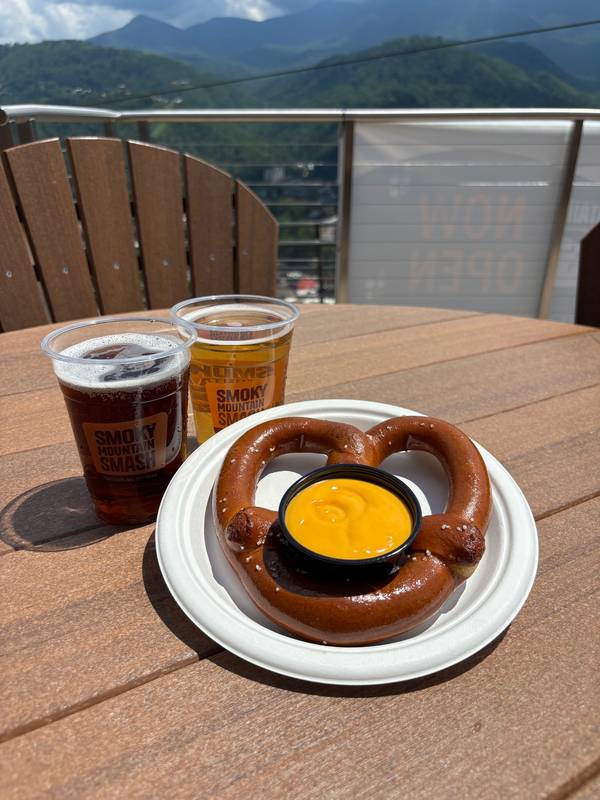A soft pretzel and draft beer from Smoky Mountain Sips