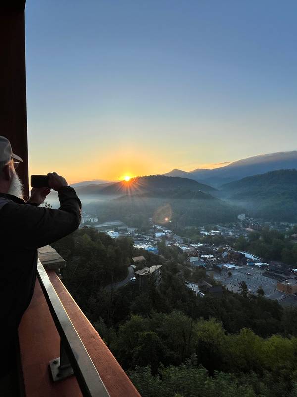 team member taking a photo of the sunrise - 2024
