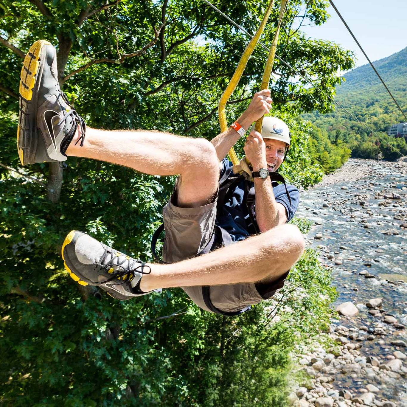 man riding the zipline
