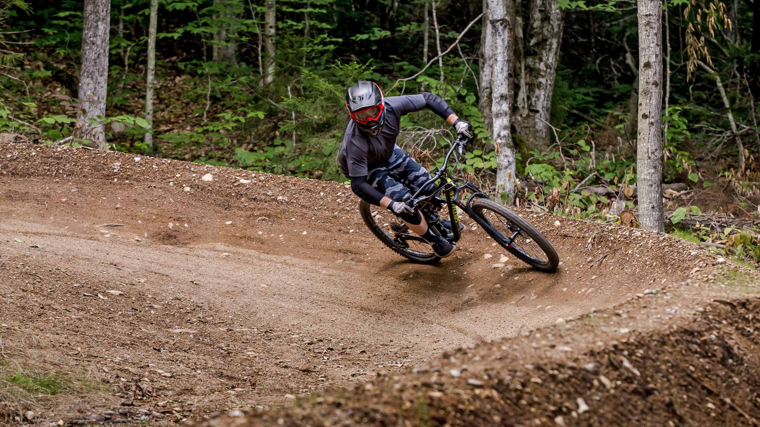 Man riding a berm in Loon Mountain Park
