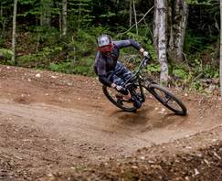 Man riding a berm in Loon Mountain Park