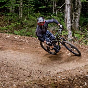Man riding a berm in Loon Mountain Park