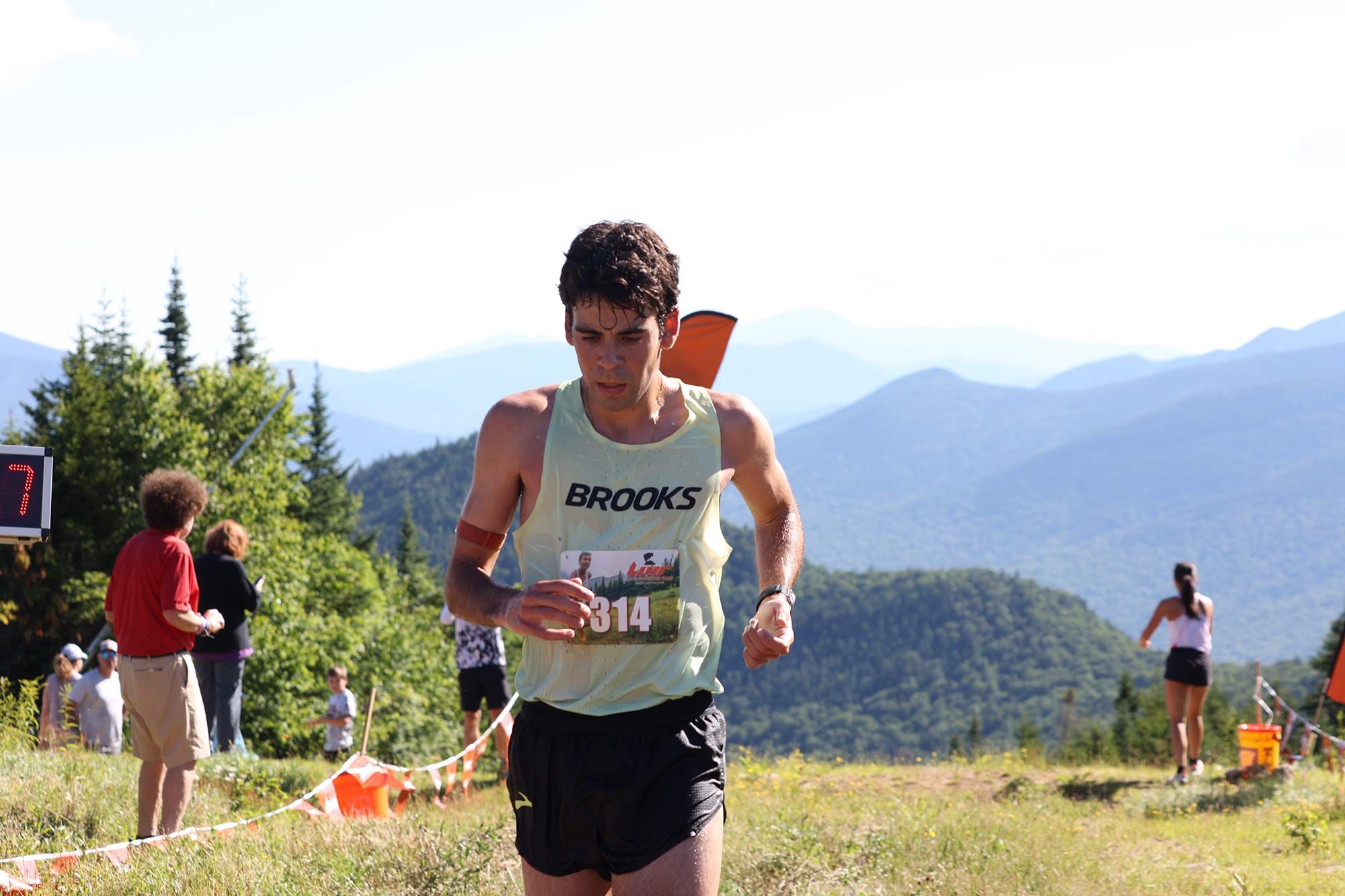 male racer with mountains in background