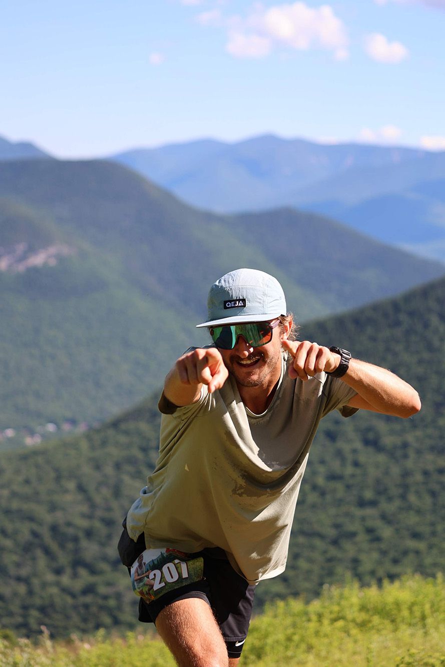 man pointing at camera and smiling