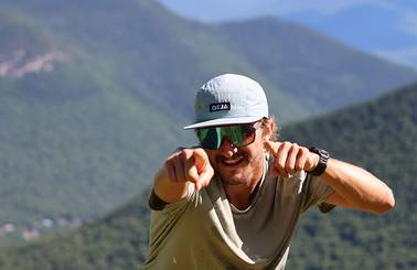 man pointing at camera and smiling