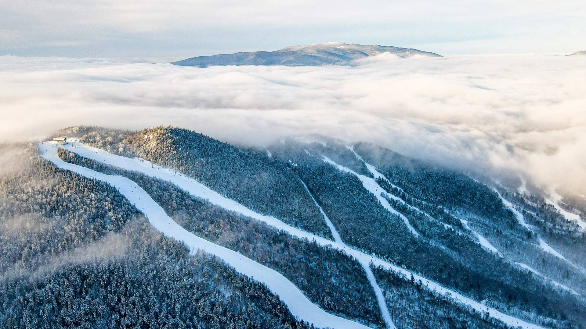 Drone image of North Peak with clouds overhead