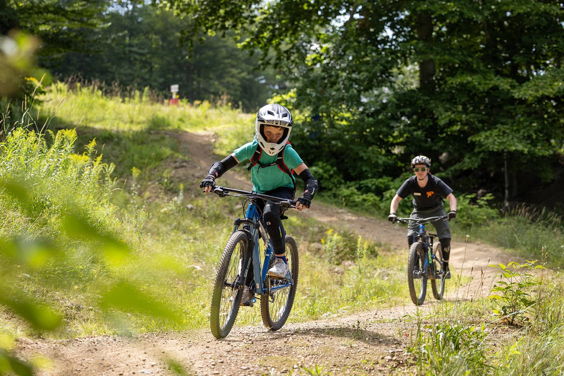 young rider and coach in Kids Rip Bike Camp at Loon Mountain