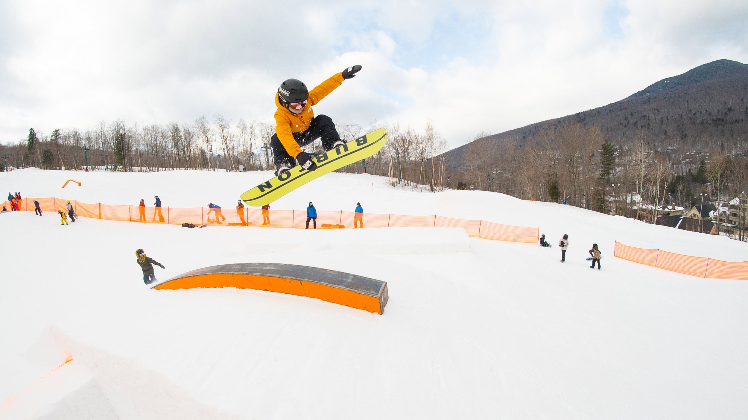snowboarder riding rail