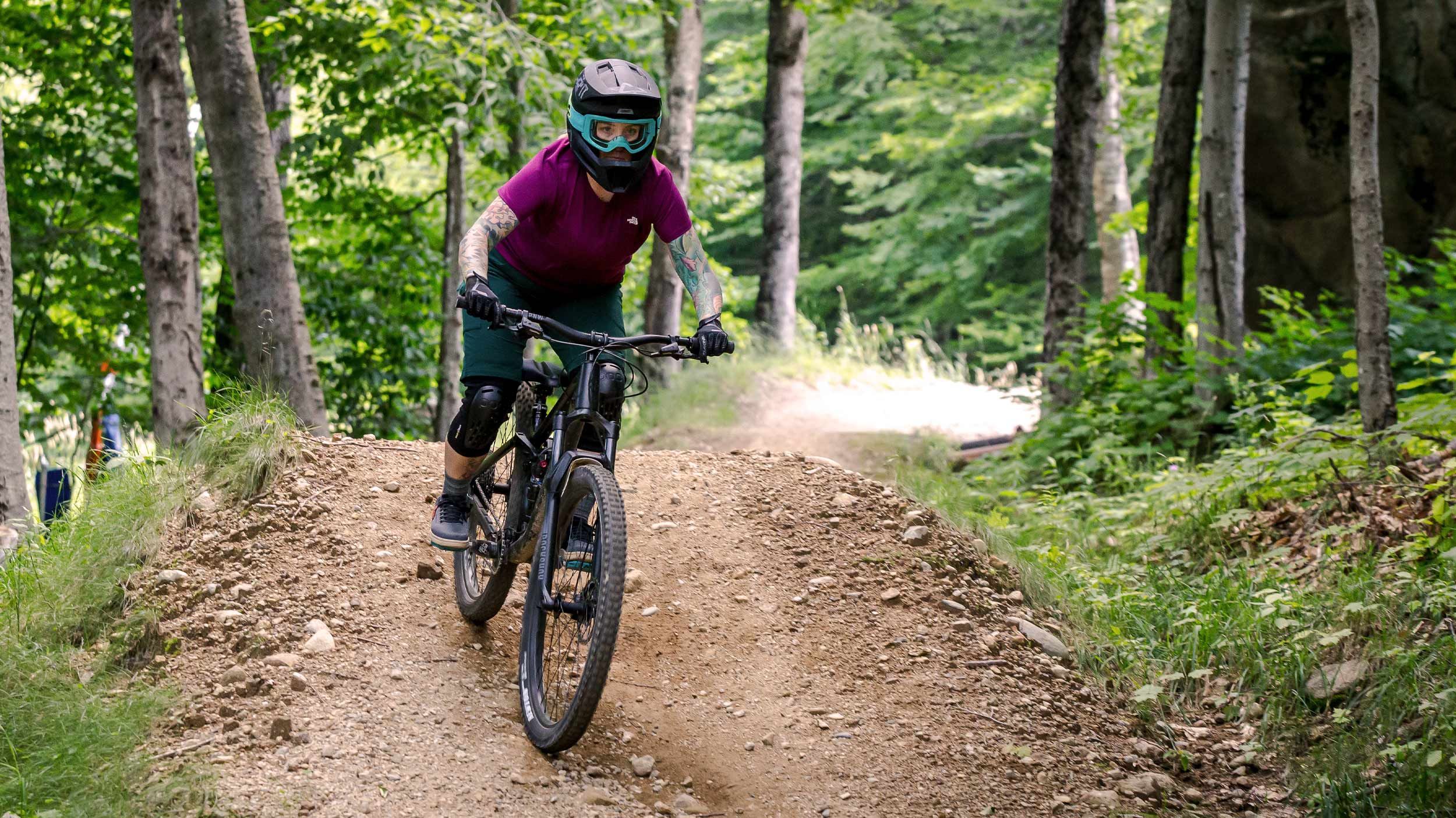 women downhill mountain biking