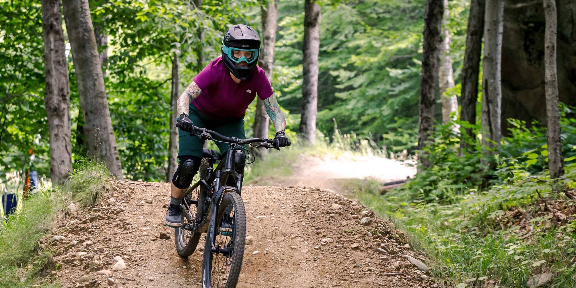 woman riding downhill mountain bike in Loon Bike Park