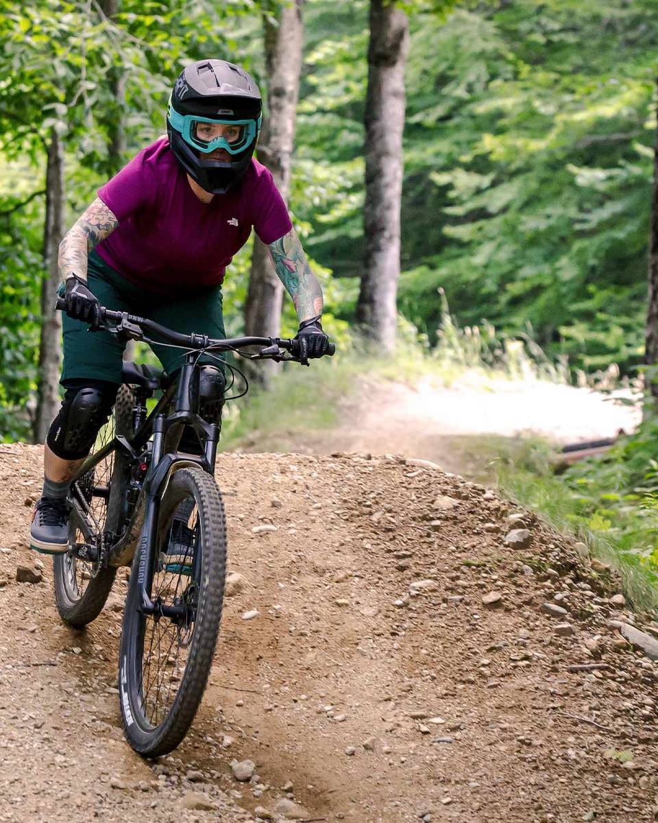 women downhill mountain biking