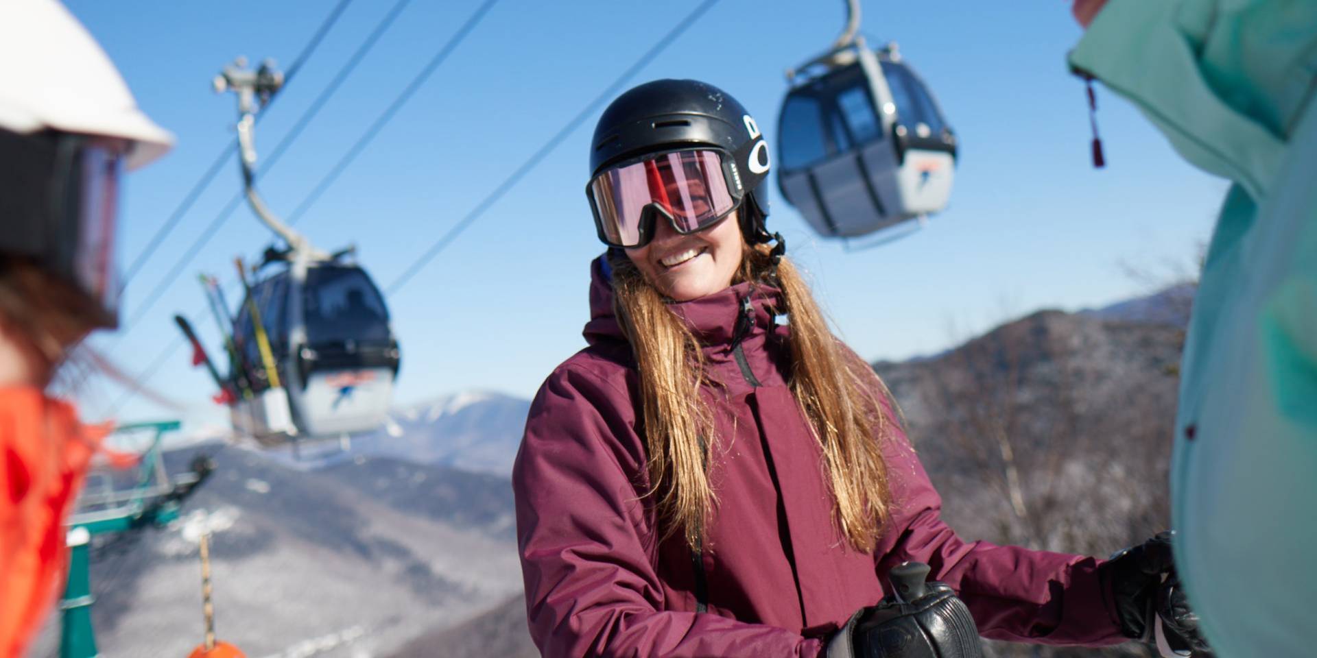 women smiling with the Gondola in the background