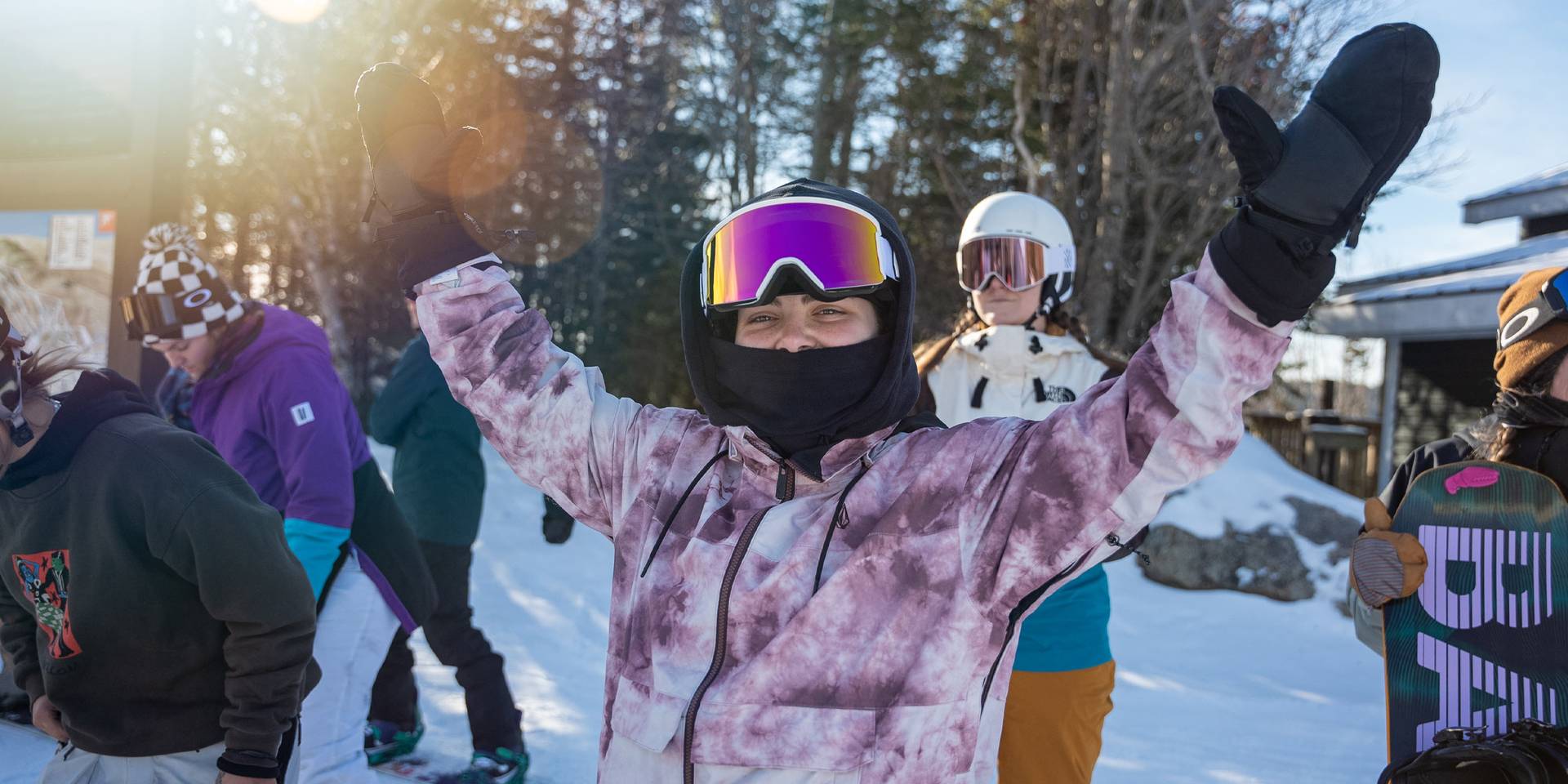 female snowboarder celebrating