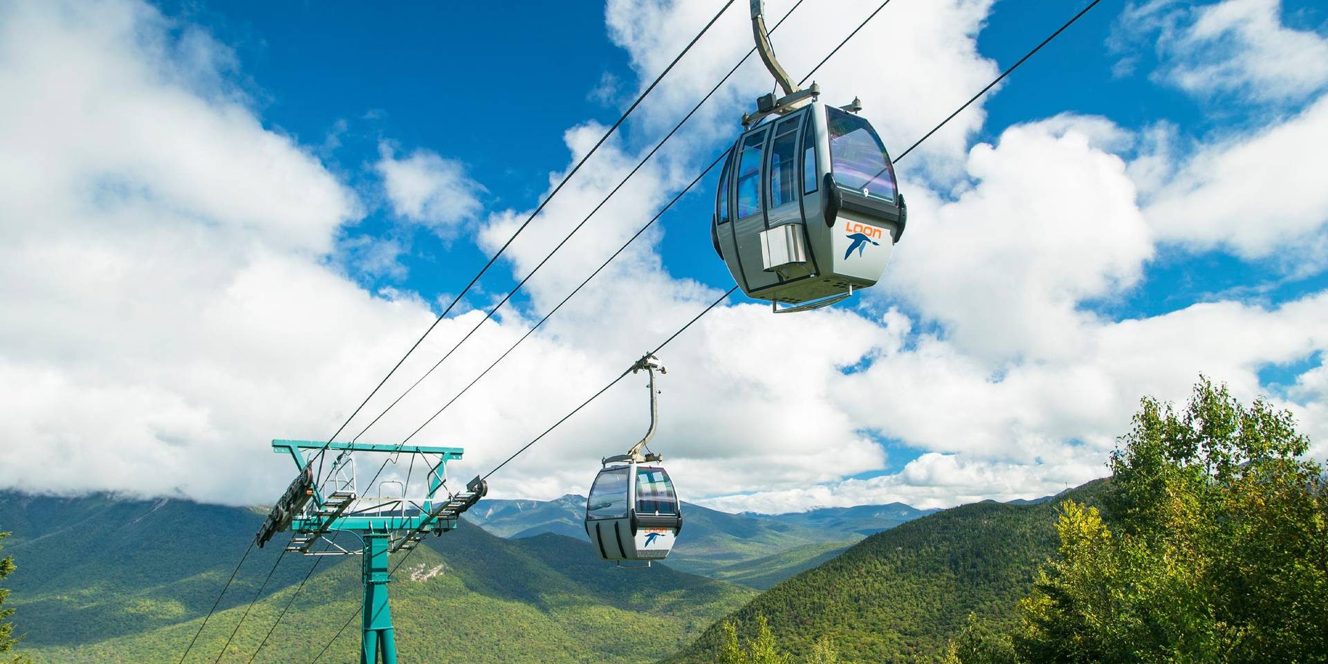 Loon gondola with mountain summits in the background