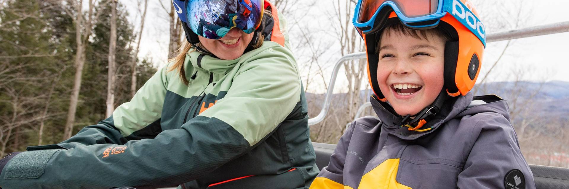 Child and adult on chairlift