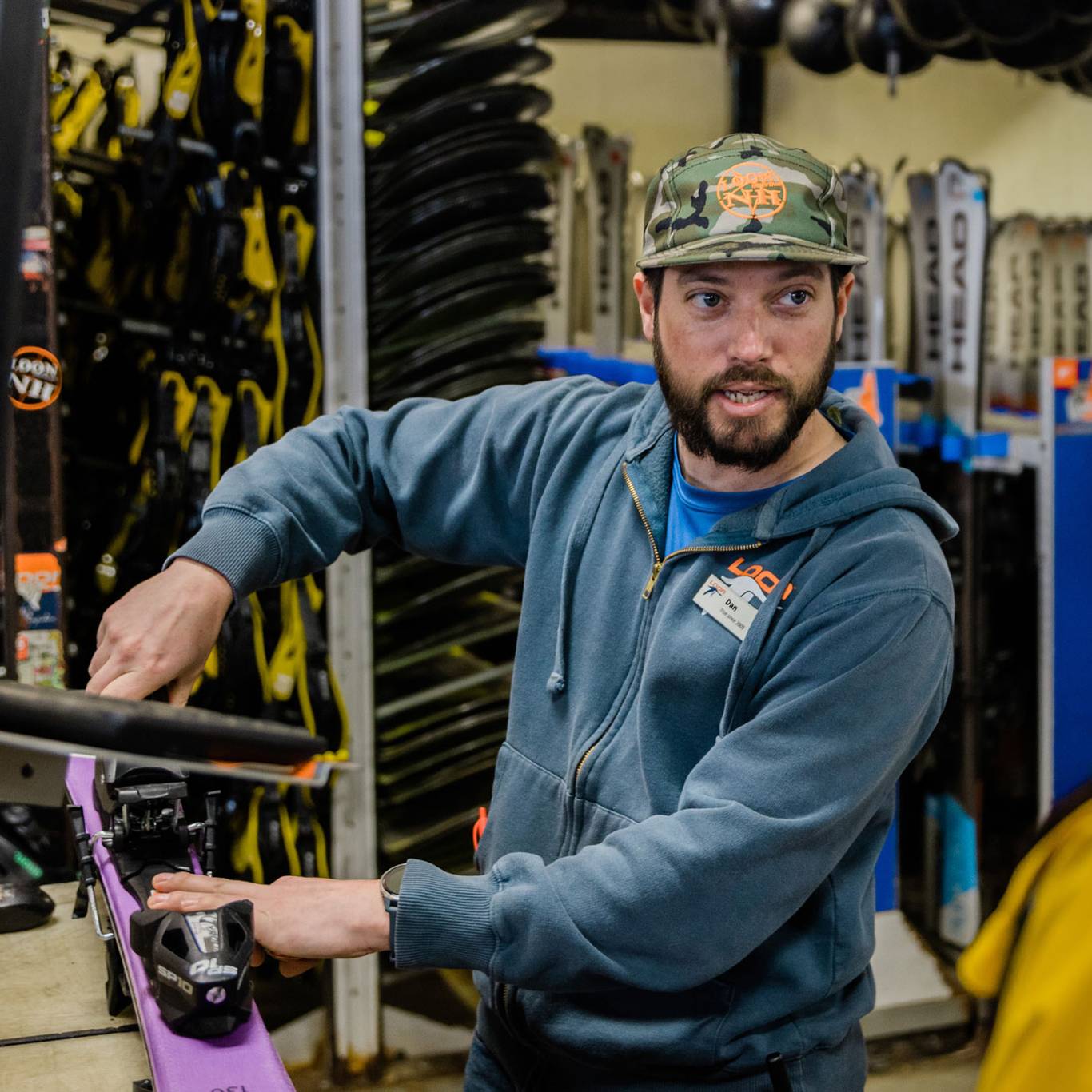 Rental shop attendant assisting a guest