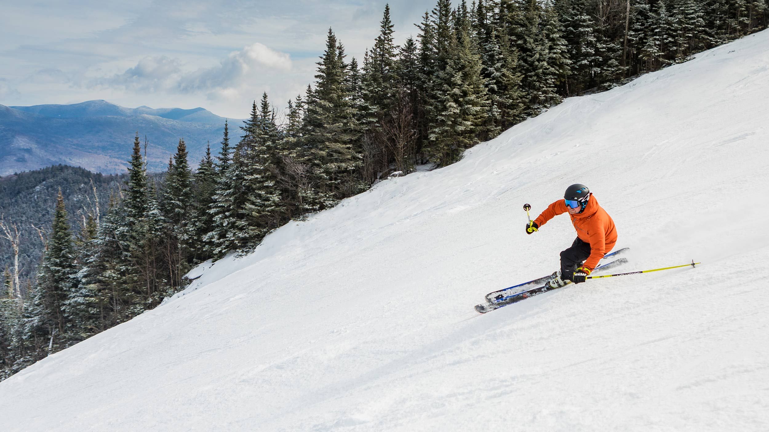 skier going down trail