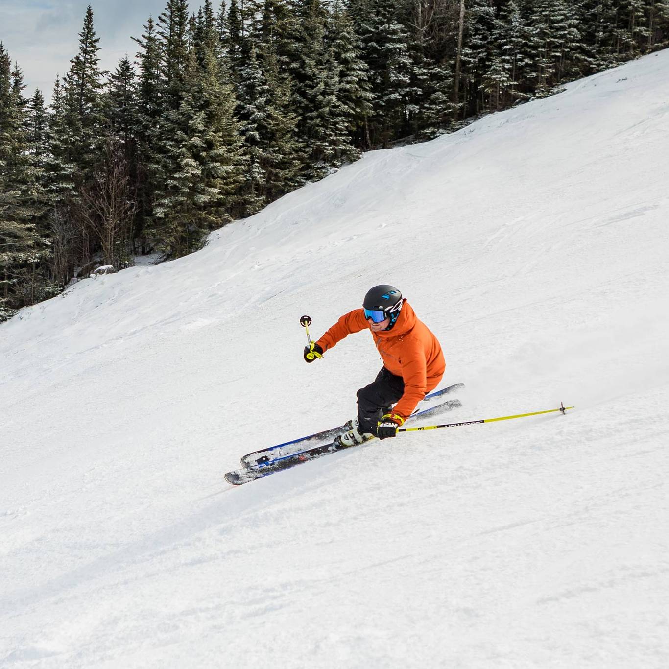 skier in orange jacket