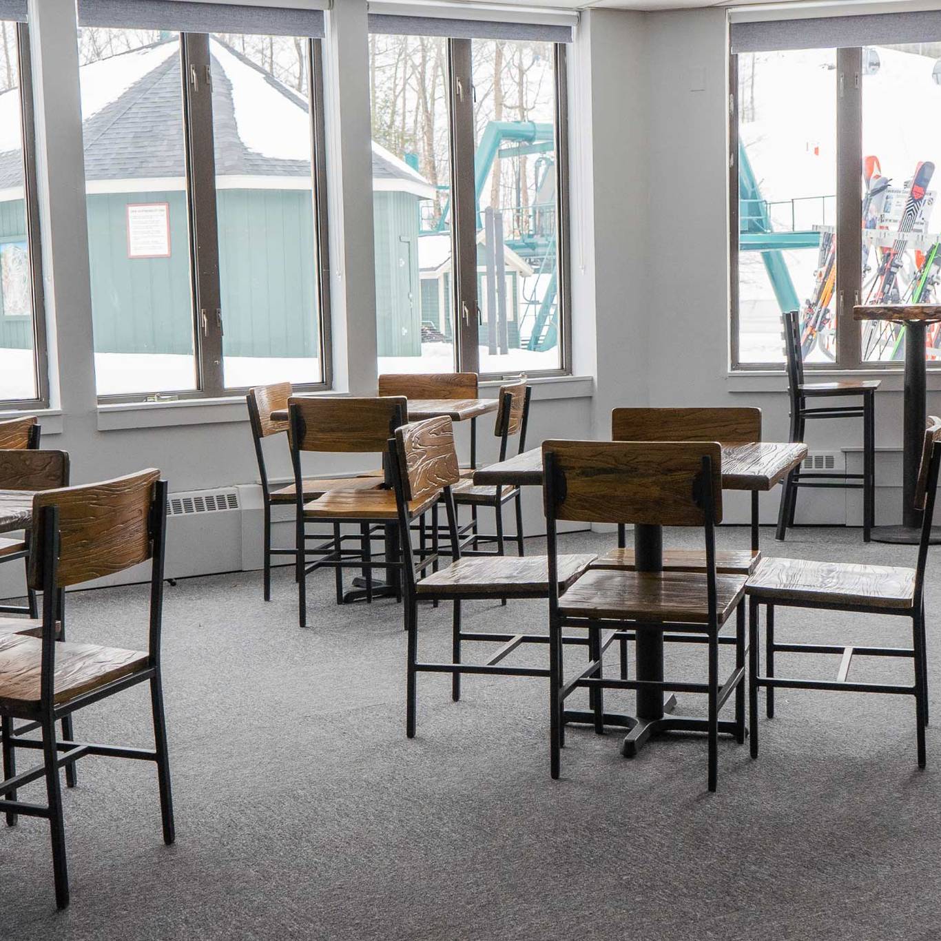 empty tables and chairs inside the junction