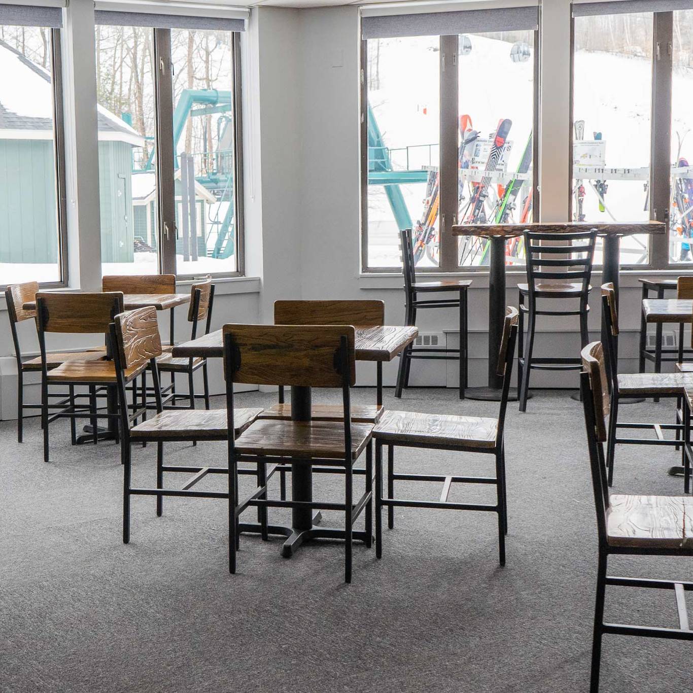 empty tables and chairs inside the junction