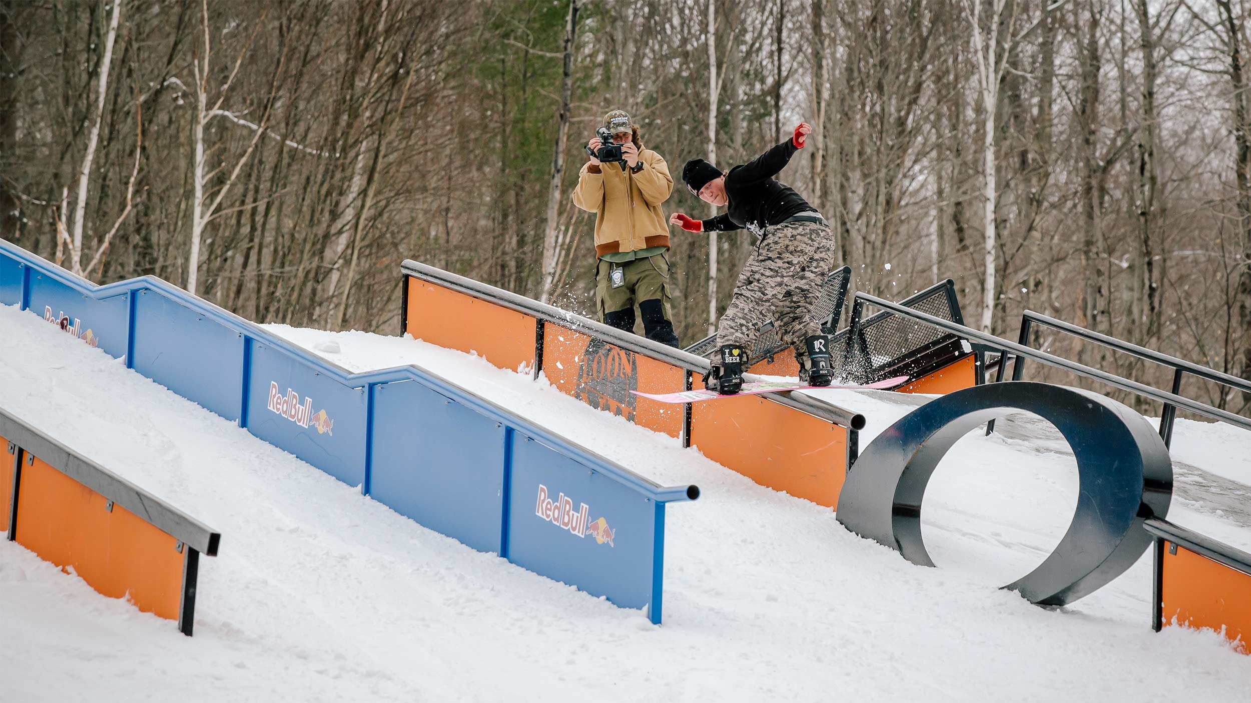 male snowboarder flipping upside down