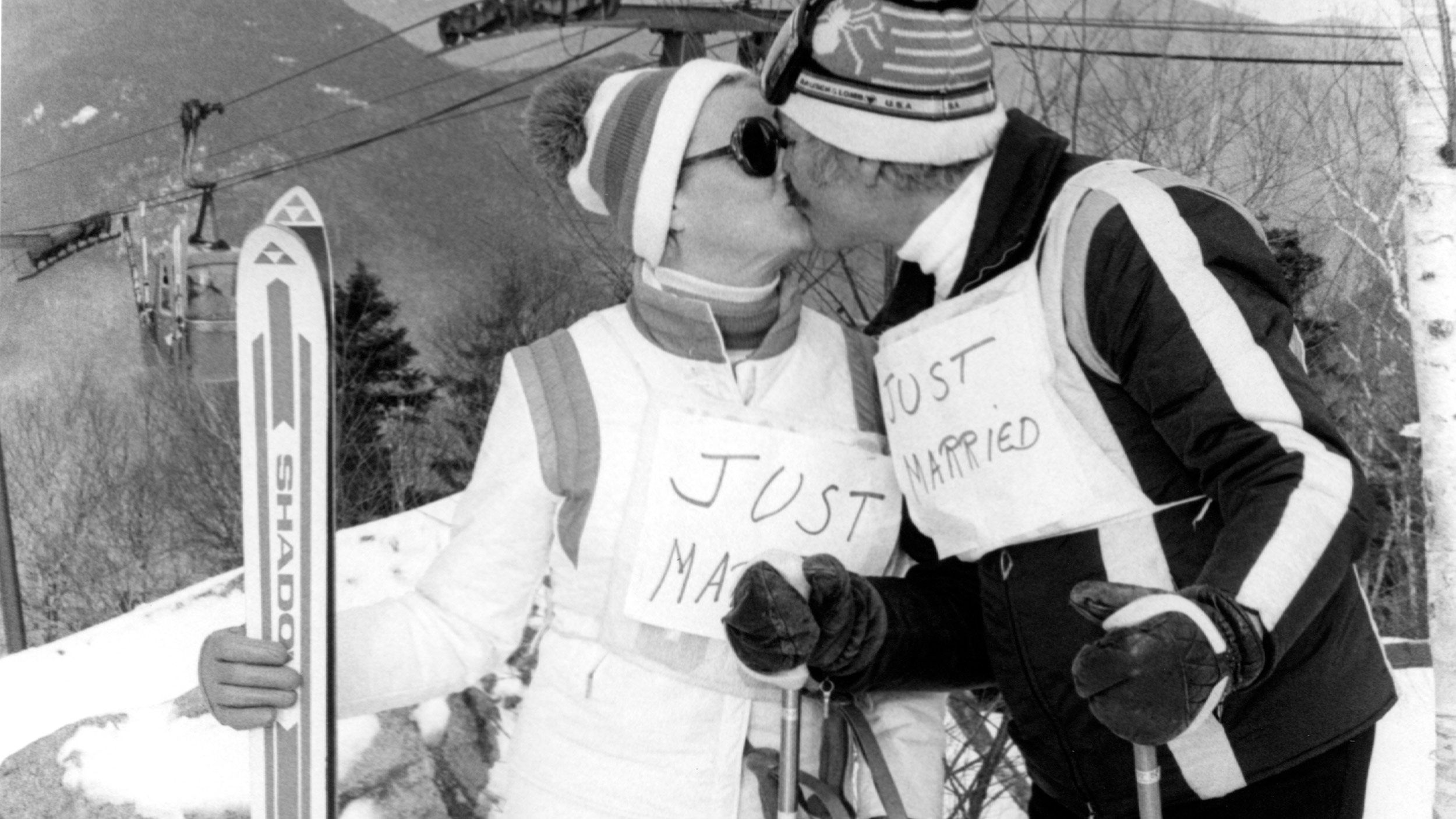 just married couple with skis in their hands