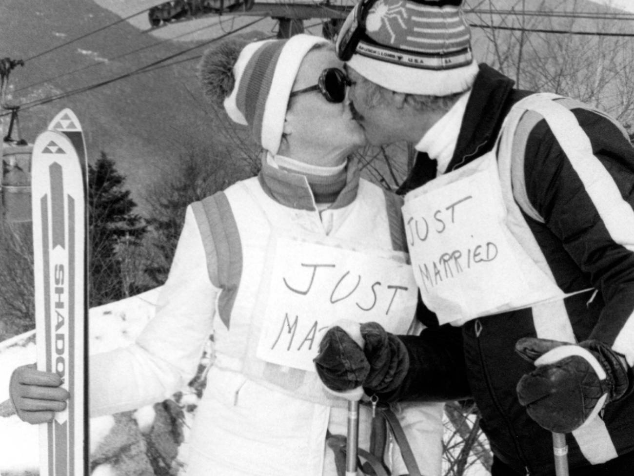 just married couple with skis in their hands