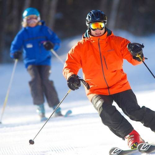 skier with a coach making turns