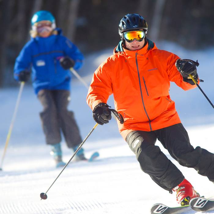 Man receiving a private ski lesson at Loon Mountain