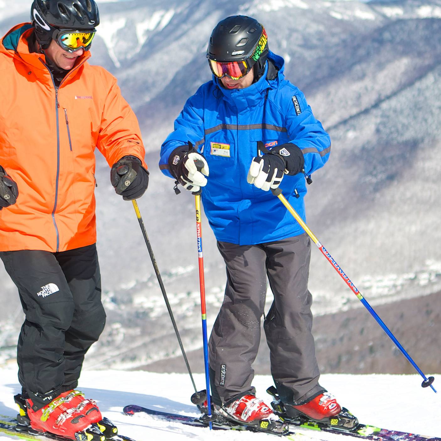 skier getting a private lesson from a coach
