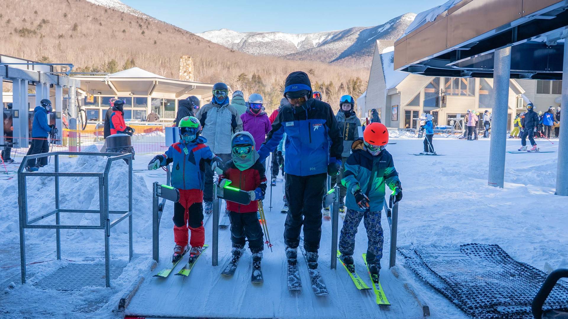 seasonal program kids and coach getting on lift